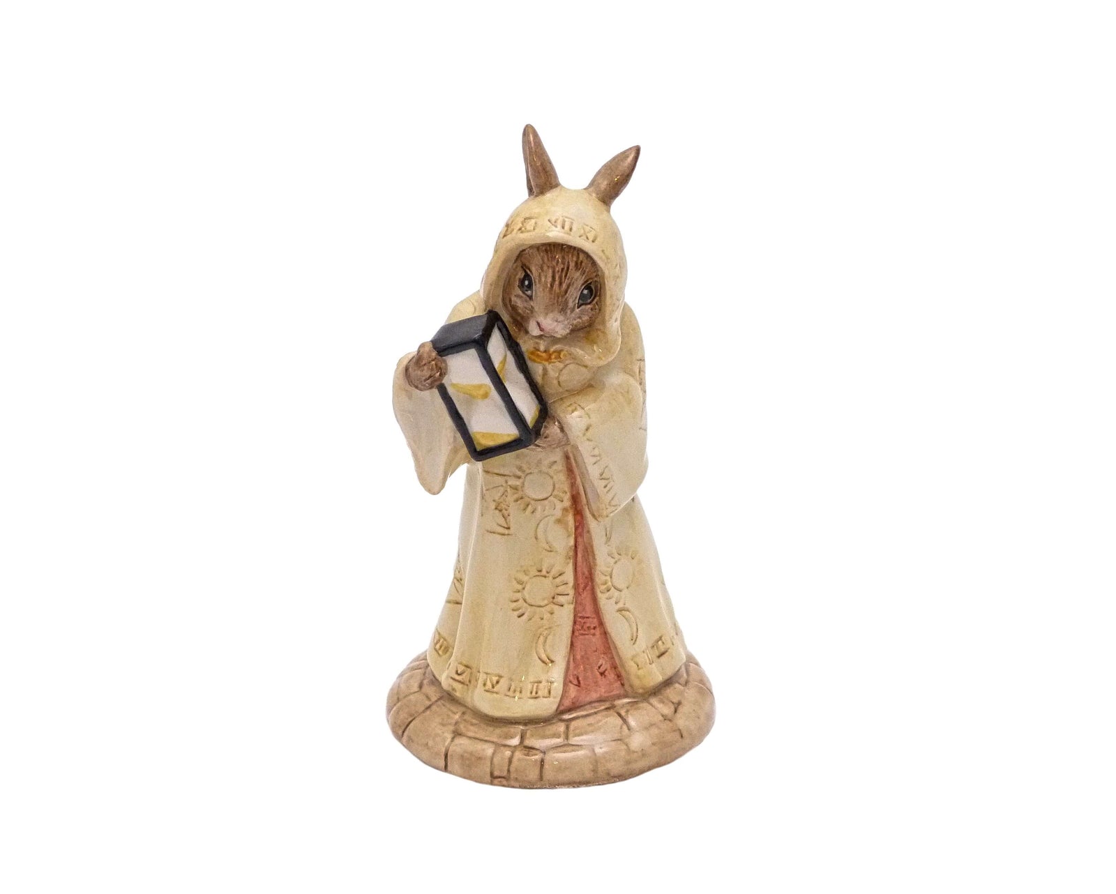 Bunnykins figure wearing a long hooded coat, holding a hourglass.