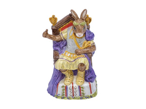 Bunnykins Emperor figure sitting on an elaborate throne, wearing gold clothes and boots, a purple cape and laurel wreath.