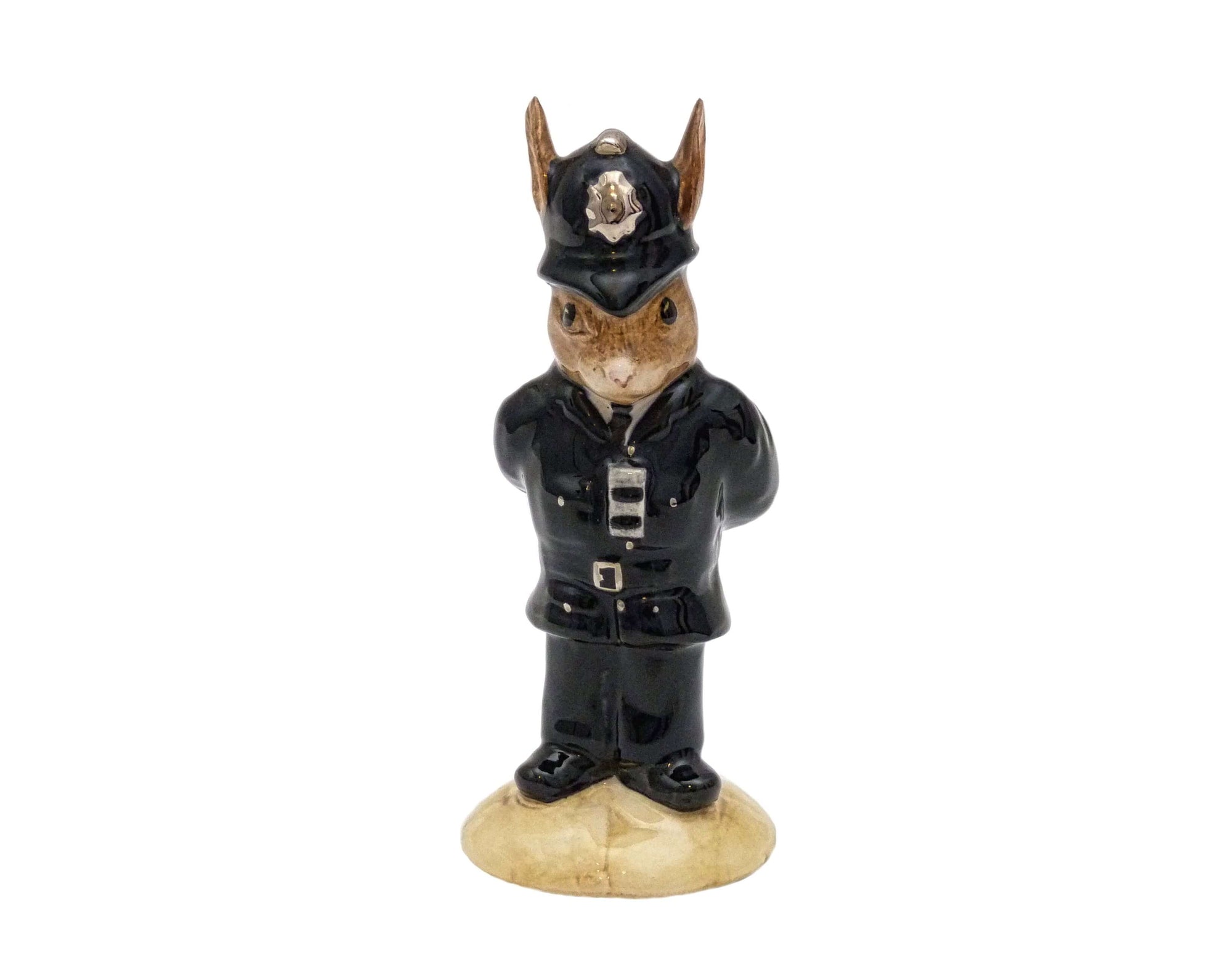 Bunnykins Policeman figure.  He is wearing his policemans helmet and standing with his hands behind his back.
