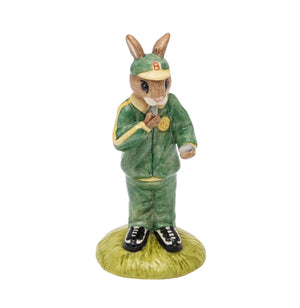 Stopwatch Bunnykins is wearing a green and gold tracksuit, holding a stopwatch and blowing a whistle.