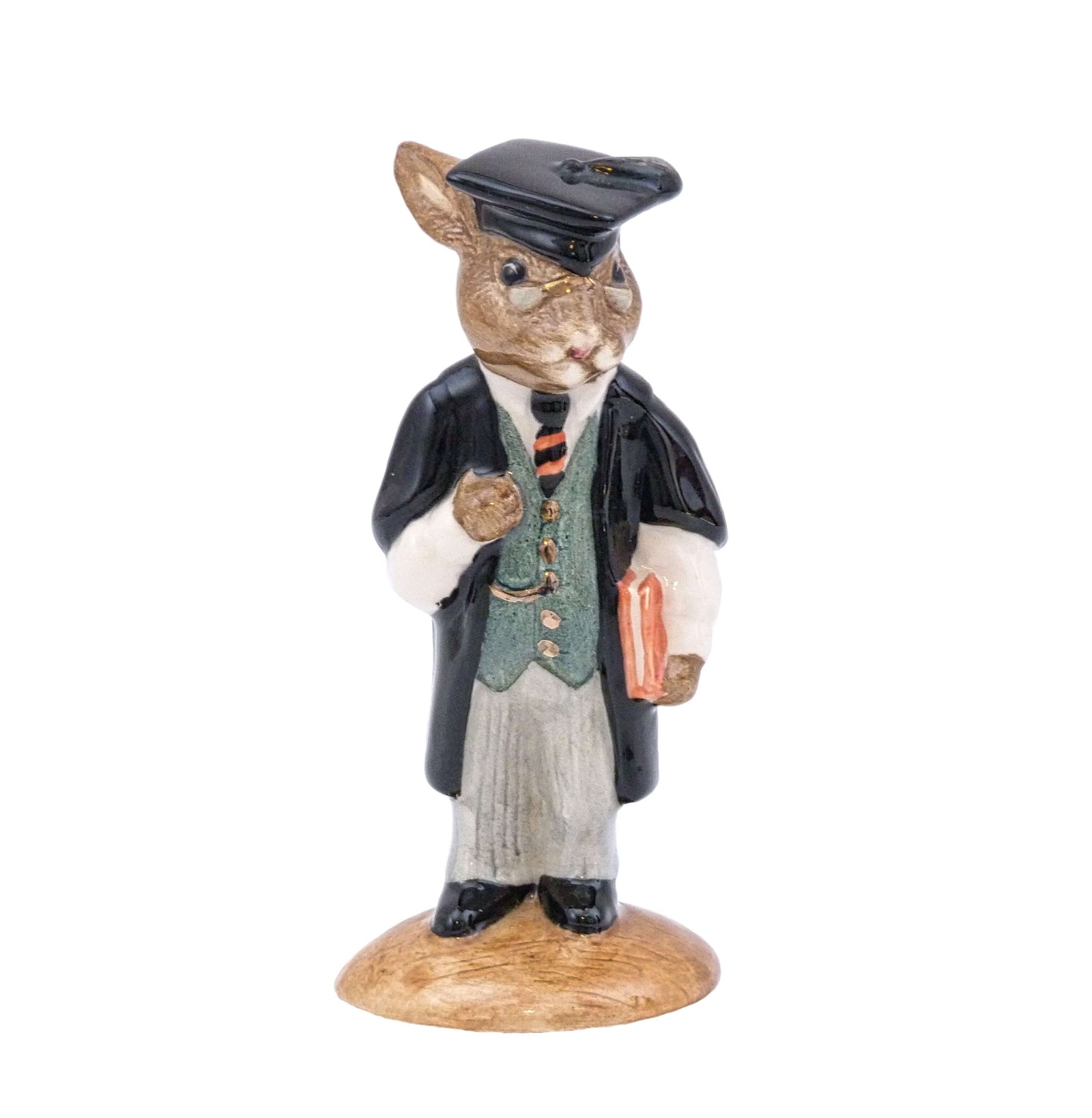 The Bunnykin is dressed in his black academic cape and wearing his mortar board.
