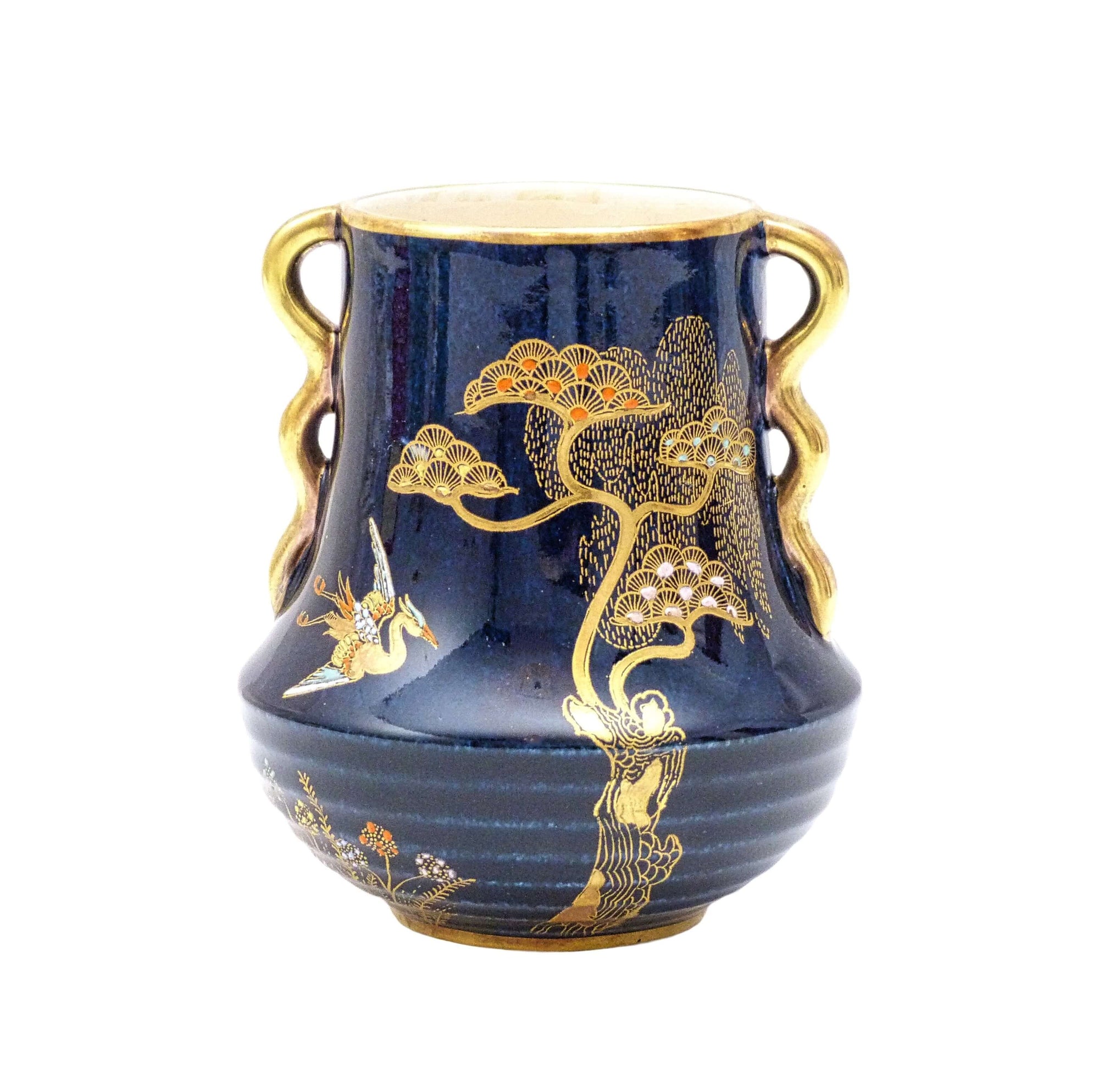 Shiny dark blue small vase with gold handles and rim. Decorated on the body with  hand painted Asian style tree  and stork pattern.