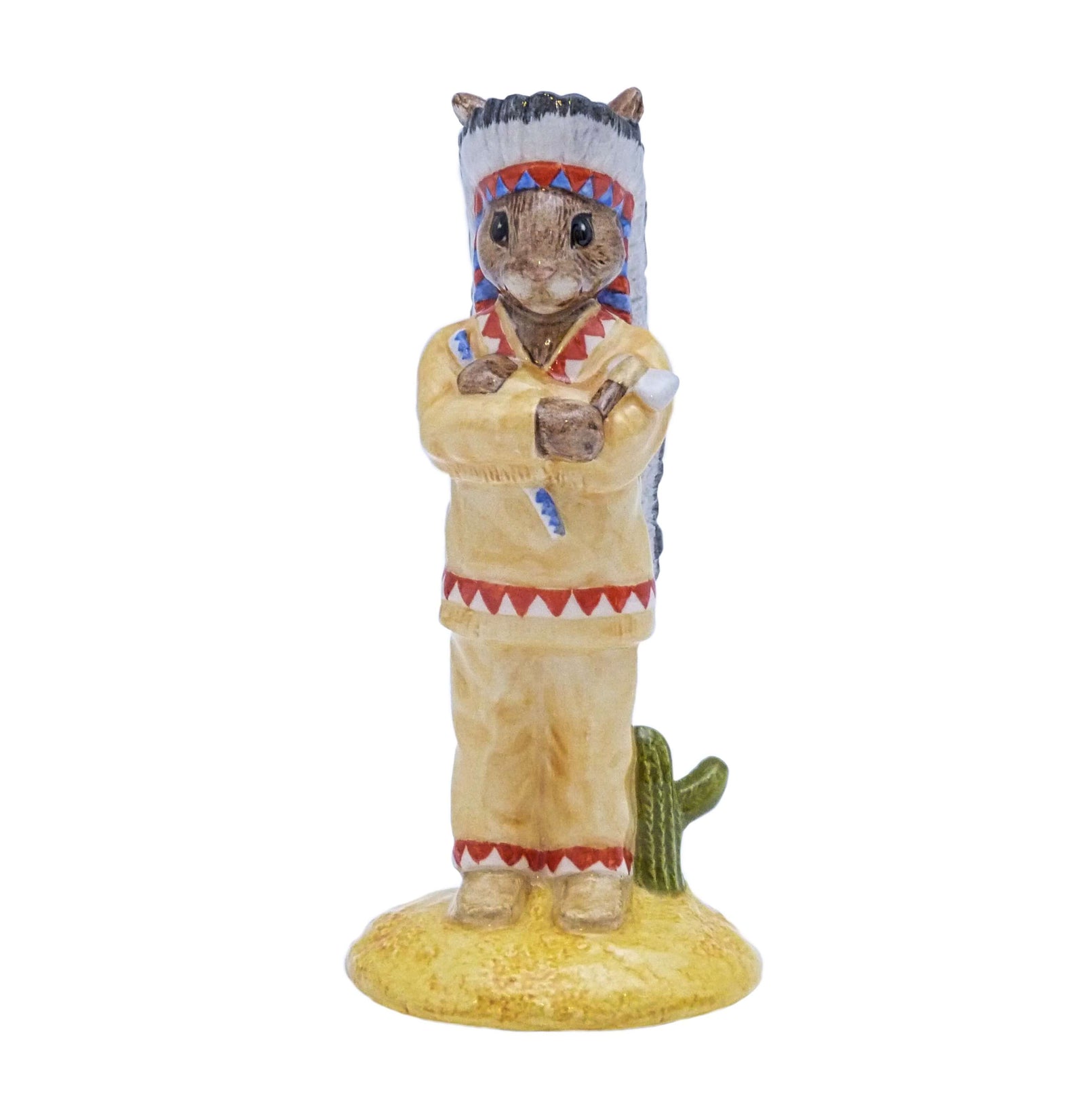 The Indian Bunnykins is standing with his arms folded, holding his tomahawk, wearing his feathered head dress.