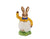 The bunny is waving as he pops out of an Easter egg wearing a bright yellow shirt and dark blue bow tie.