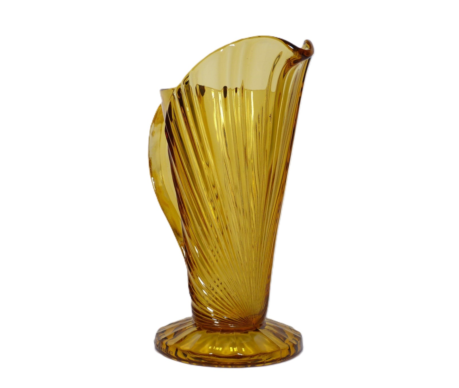 A tall slim amber glass jug widening at the top. The glass on the body of the jug is formed to fan out like the rays of the sun.